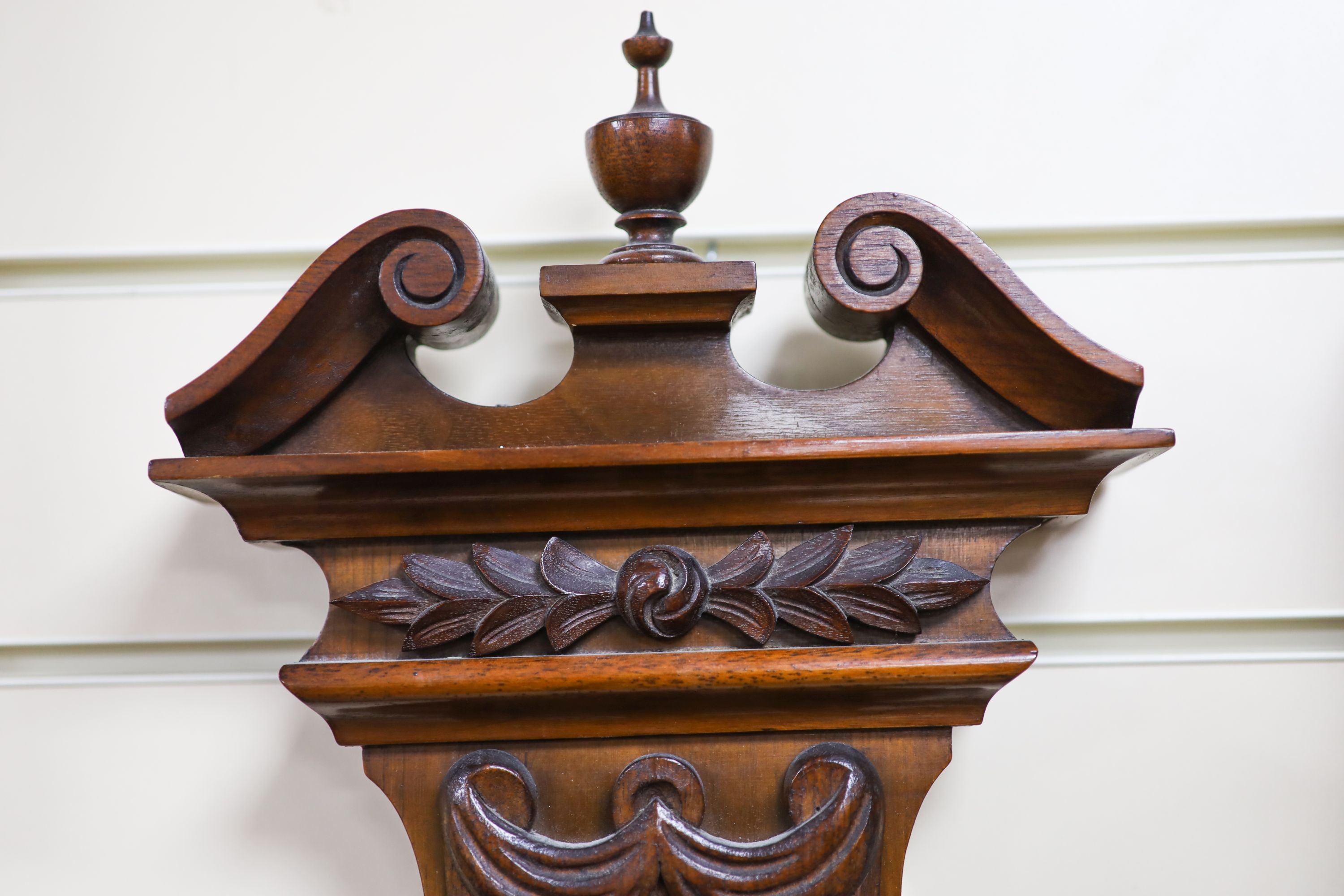 An Edwardian carved walnut cased aneroid barometer and thermometer, height 99cm